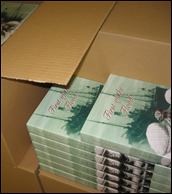 Books being packed into boxes at the YPS warehouse